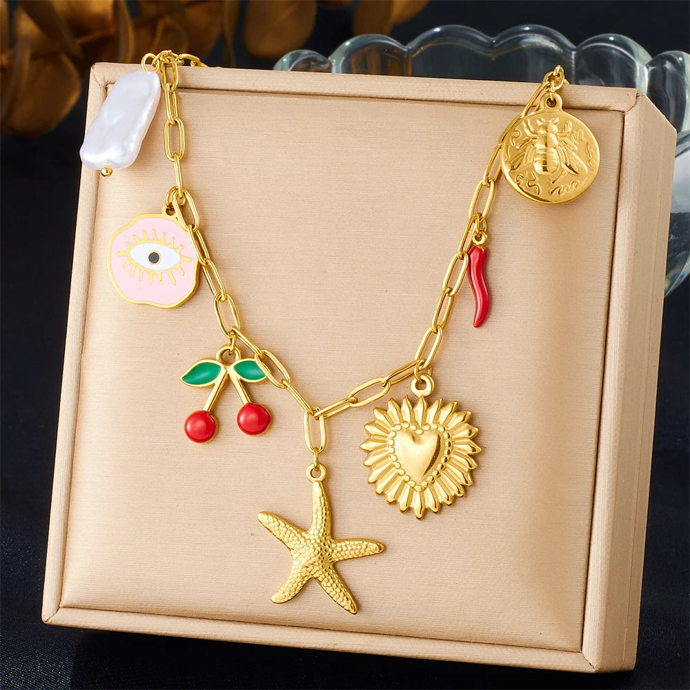 Gold stainless steel starfish heart pendant necklace displayed in a light pink box