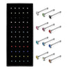 A set of stainless steel nose studs and body piercing jewelry in various colors and styles.