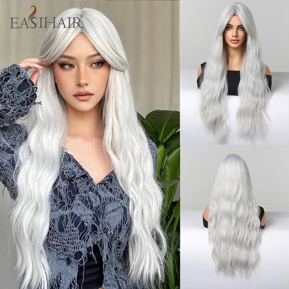 A model showcases a long, wavy, platinum blonde wig with bangs, styled in a casual outfit.