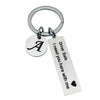 Silver keychain with an initial A and the message Drive Safe I need you here with me