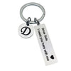 Silver keychain with a D initial and the text Drive Safe I need you here with me
