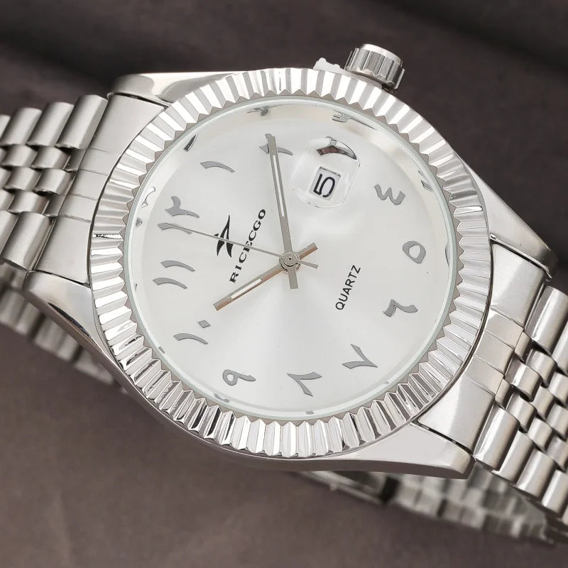 A silver-toned luxury quartz wristwatch with a white dial and date display, shown from above.