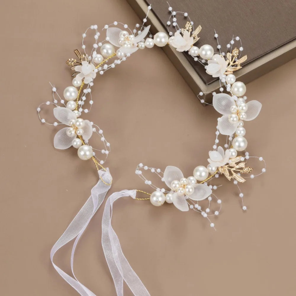 Elegant floral wreath headband made of white flowers and pearl beads with gold accents