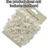 A pile of white satin hair scrunchies is shown on a cardboard backing.