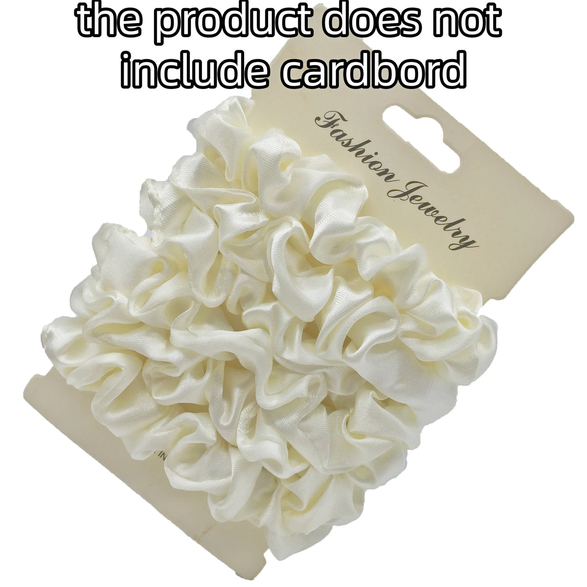 A pile of white satin hair scrunchies is shown on a cardboard backing.