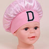 Pink A-Z letter sleep cap for kids with a black letter D