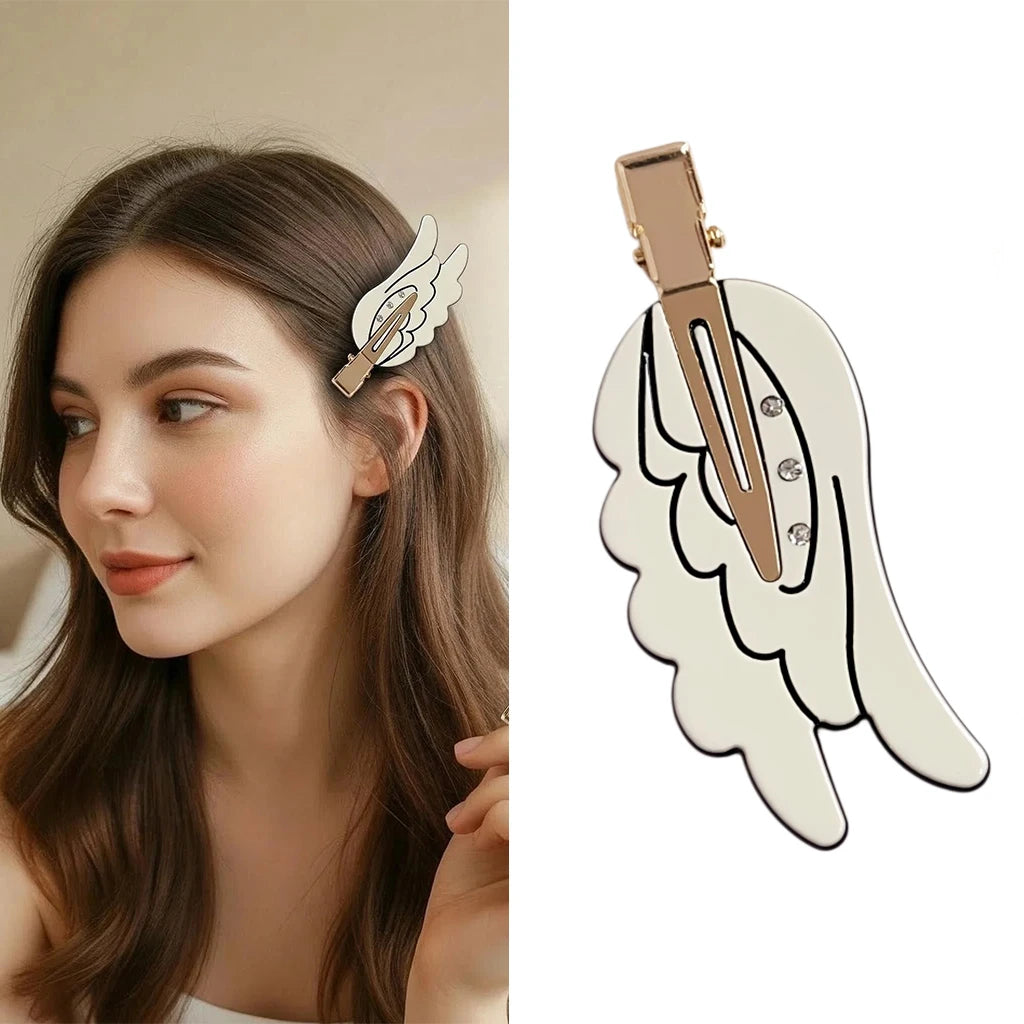A close-up of a woman with long brown hair wearing cute angel wing hair clips and barrettes.