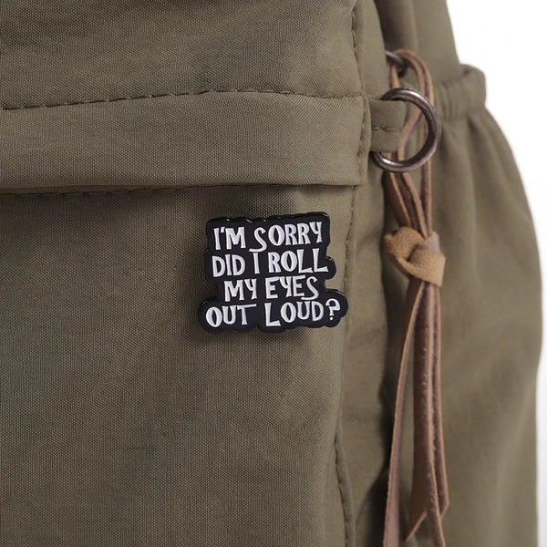 A black enamel pin with the text I'm sorry did I roll my eyes out loud?