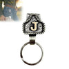Silver letter J pendant on a ring with a textured design and a leather strap.