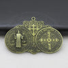 A round bronze medal featuring a cross and religious symbols, designed for wall decor.
