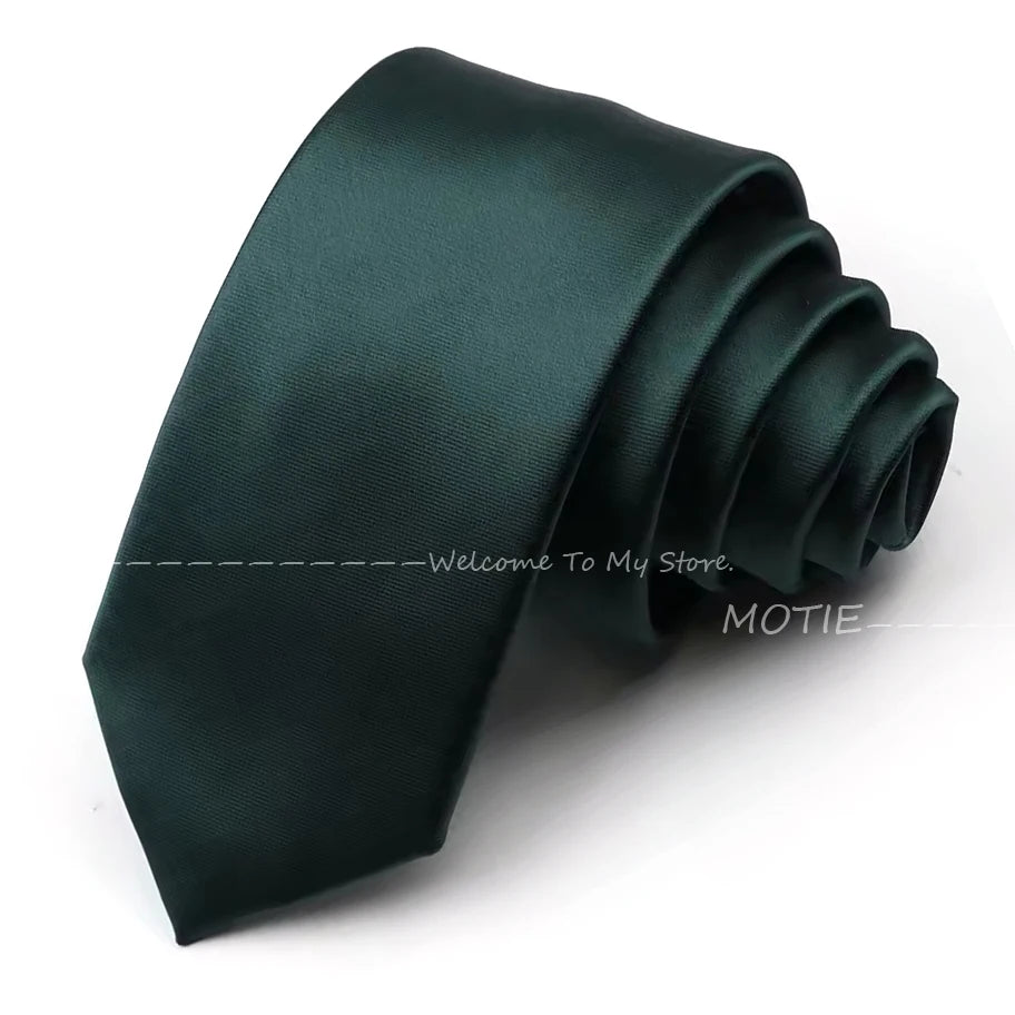 A dark emerald green satin neck tie folded and displayed on a white background.