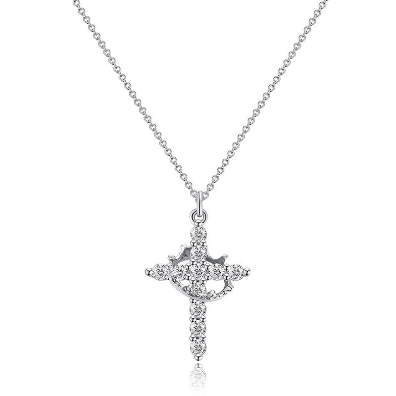 Silberkette mit rotierender Zirkonkreuz-Anhänger und passenden Ohrringen.