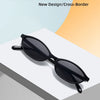 Black retro oval frame sunglasses displayed on a white surface.