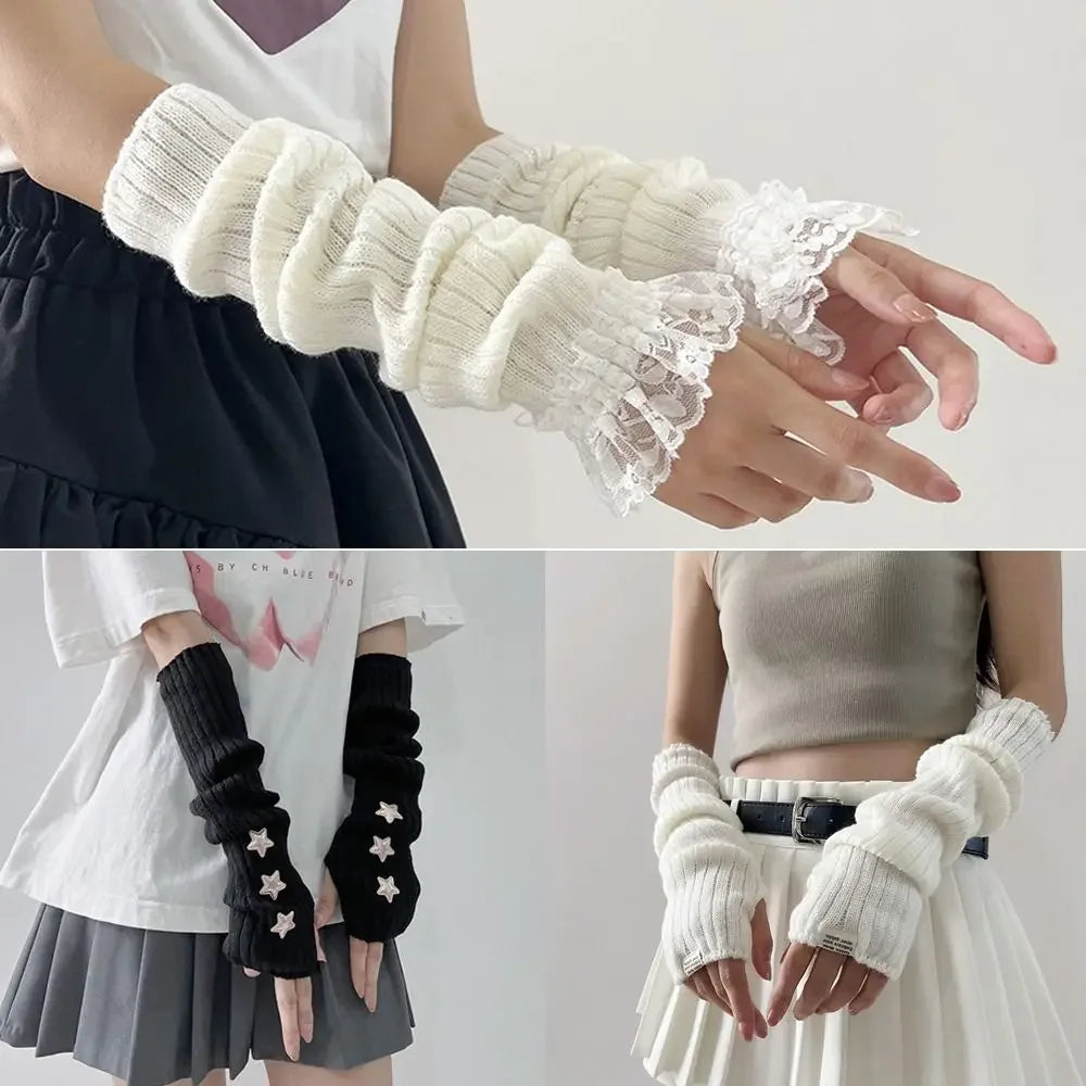 A close-up of a hand wearing white fingerless arm warmers with lace detailing.