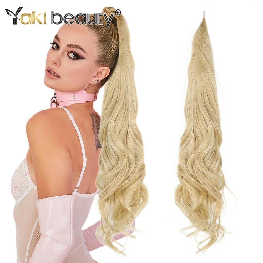 A model showcases 32-inch synthetic wrap around hair extensions in a blonde color, styled in a high ponytail.