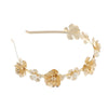 Gold leaf headband featuring delicate floral accents for bridal or party wear