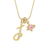 Gold letter pendant necklace featuring an initial charm and a pink gemstone.