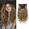 A model shows long wavy blonde hair with black hair extensions installed on the crown.