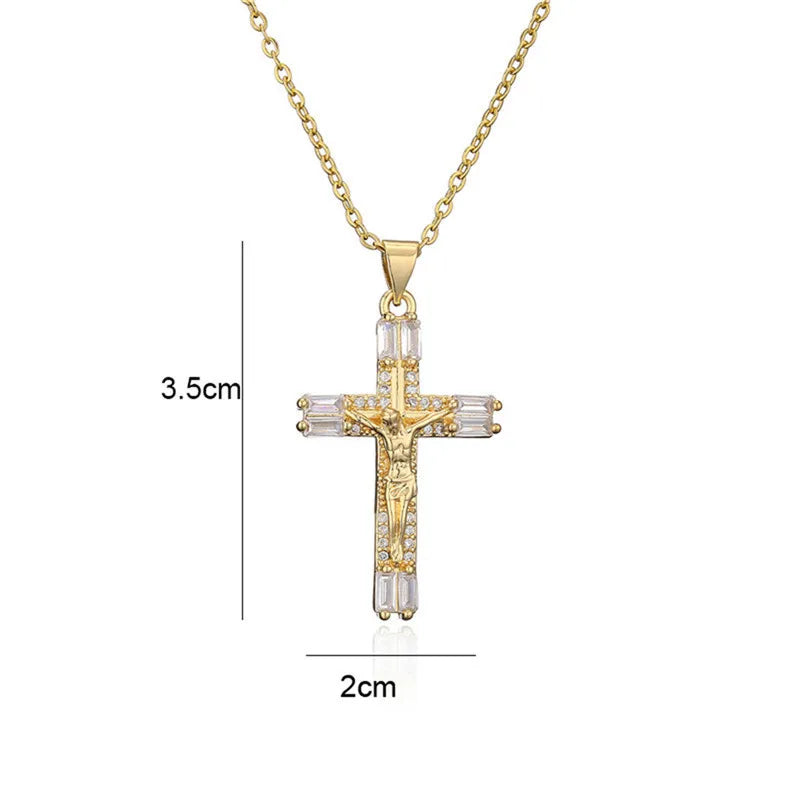 A dainty gold cross charm necklace featuring clear crystals and a pendant design.