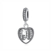 A silver family tree charm necklace featuring a detailed tree design and a textured bail.