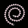 A spiral arrangement of pink heart-shaped rhinestones forming a necklace and bracelet set.
