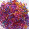 A pile of colorful disposable hair scrunchies in various shades including pink, purple, yellow, and orange.
