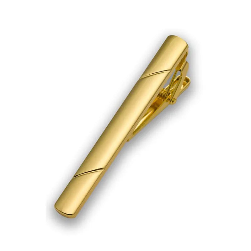 A gold-toned tie clip jewelry piece shown in a diagonal view.