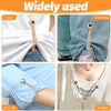 Various magnetic clothing clips used on a T-shirt, trouser leg, shirt cuff, and cardigan.