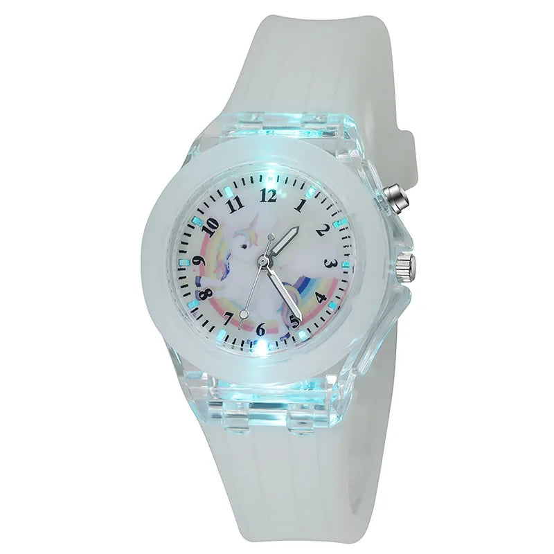 A white fashion watch with a clear crystal face featuring a unicorn design and pink accents.