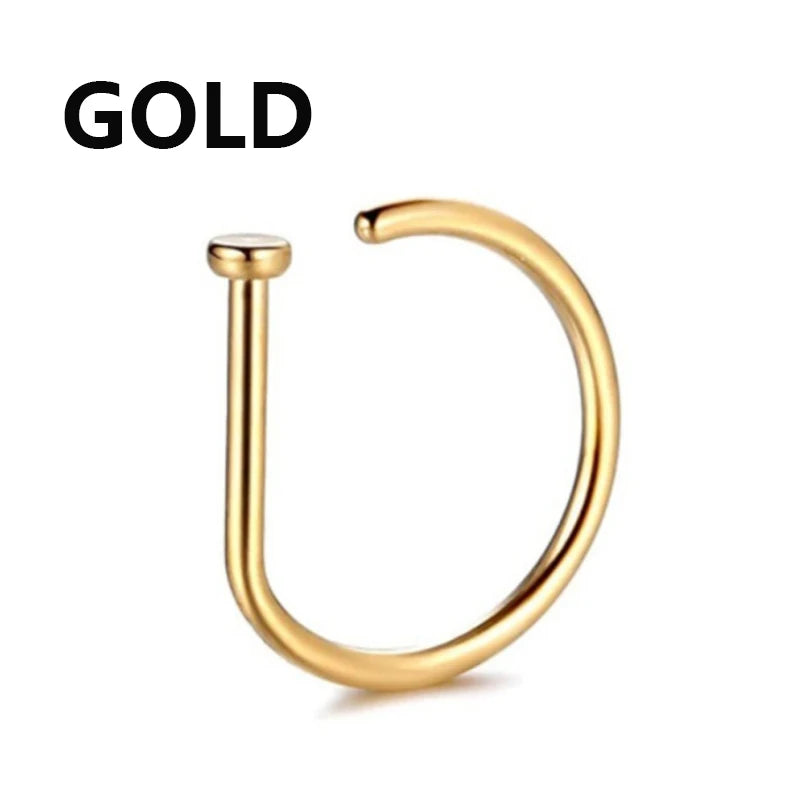 A single gold hoop nose ring jewelry piece shown against a white background.