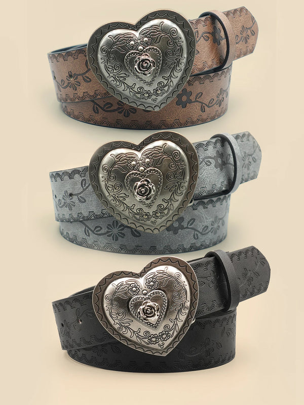 A close-up of a heart-shaped retro embossed leather belt in various shades of brown and black.