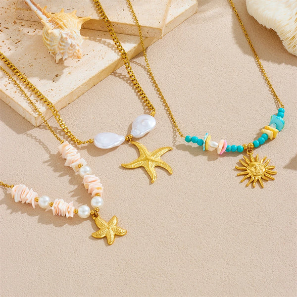 Gold and turquoise beaded necklaces featuring starfish and heart pendants on a light background