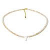A delicate necklace featuring mother of pearl beads and crystal accents.