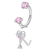 A set of silver horseshoe nose rings featuring pink gemstone studs and a delicate winged charm.
