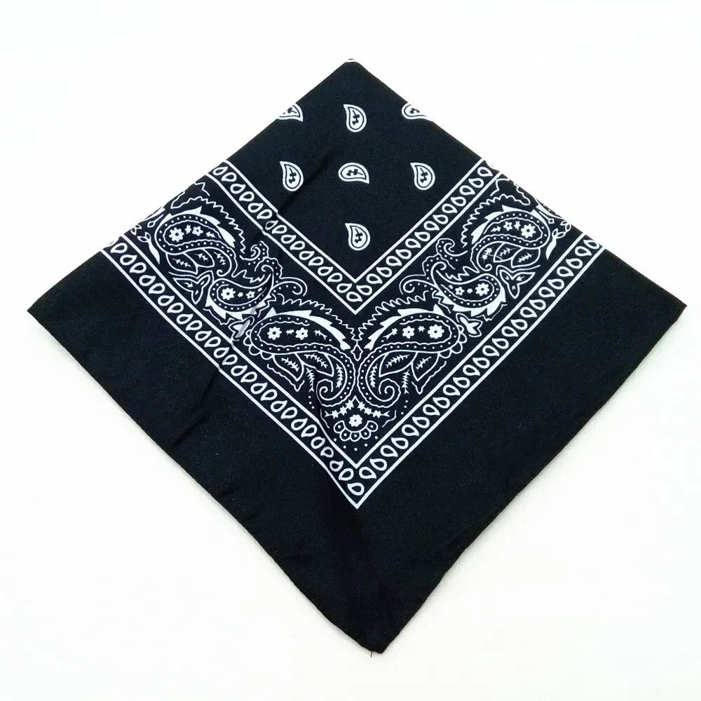 Black bandana featuring white paisley and geometric patterns for a headband or wrist wrap set