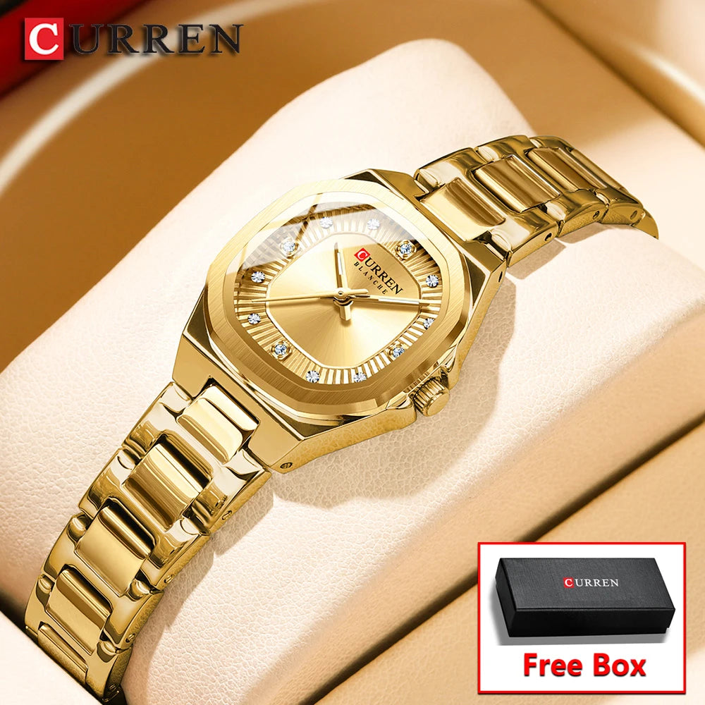 Goldakzent-Quarz-Armbanduhr auf beigem Hintergrund mit schwarzer Box 'Free Box'.