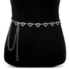 Silver heart chain body jewelry worn around the waist of a female model.