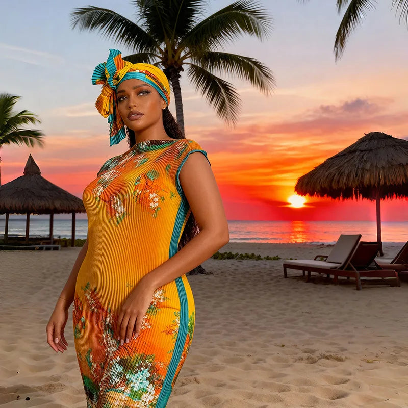 A plus size model wearing a vibrant yellow and orange African silk printed two-piece set on a beach at sunset.