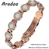 A close-up view of a rose gold pure copper magnetic crystal bracelet with round and oval elements.