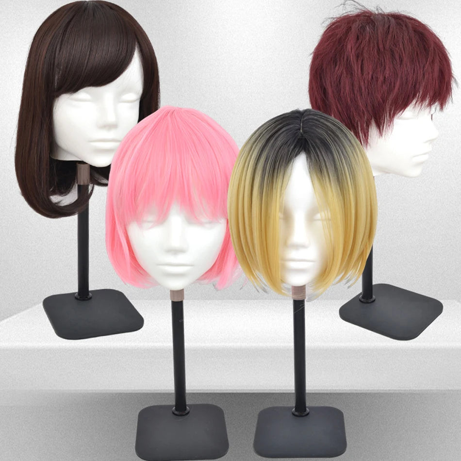 A display of several hair wigs on professional mannequin stands for practice and display.
