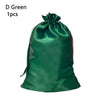 A dark green satin drawstring storage bag for hair tools.