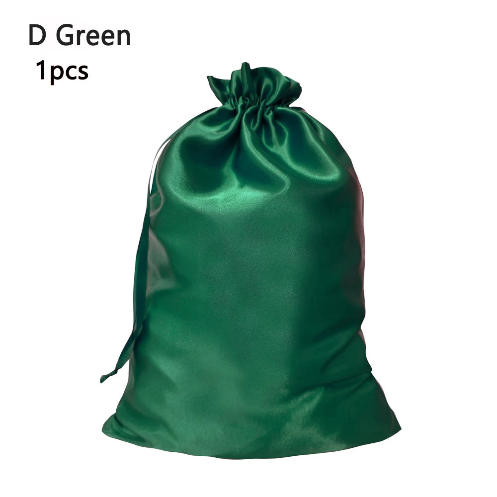 A dark green satin drawstring storage bag for hair tools.