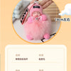 A pink fluffy plush doll with a bow and a charm is shown, measuring 14cm long.