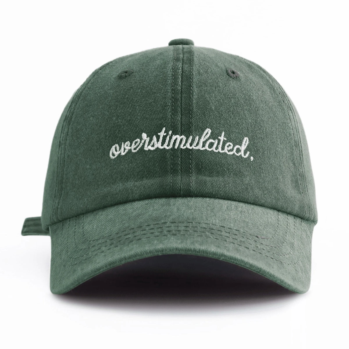 A dark olive green baseball cap embroidered with the word overstimulated on the front.