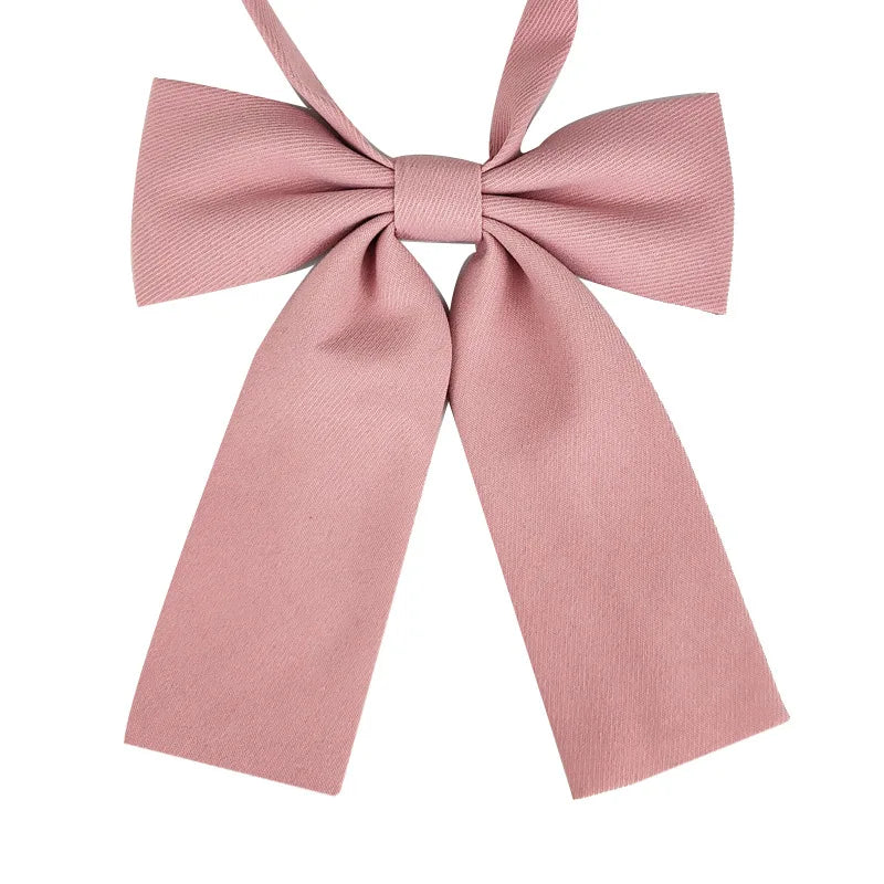 A pink butterfly ribbon tie set featuring a bow and a long ribbon for students.