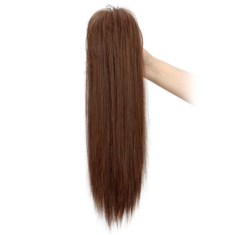 A long, straight brown hair extension being held by a hand.