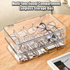A clear multi-functional compartment eyeglass storage box filled with eyeglasses and tissue paper.