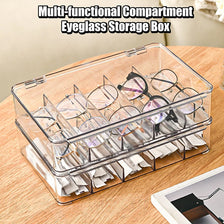 A clear multi-functional compartment eyeglass storage box filled with eyeglasses and tissue paper.