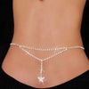 A close-up of a woman's midsection showing a sparkling crystal diamond waist belt worn around the abdomen.