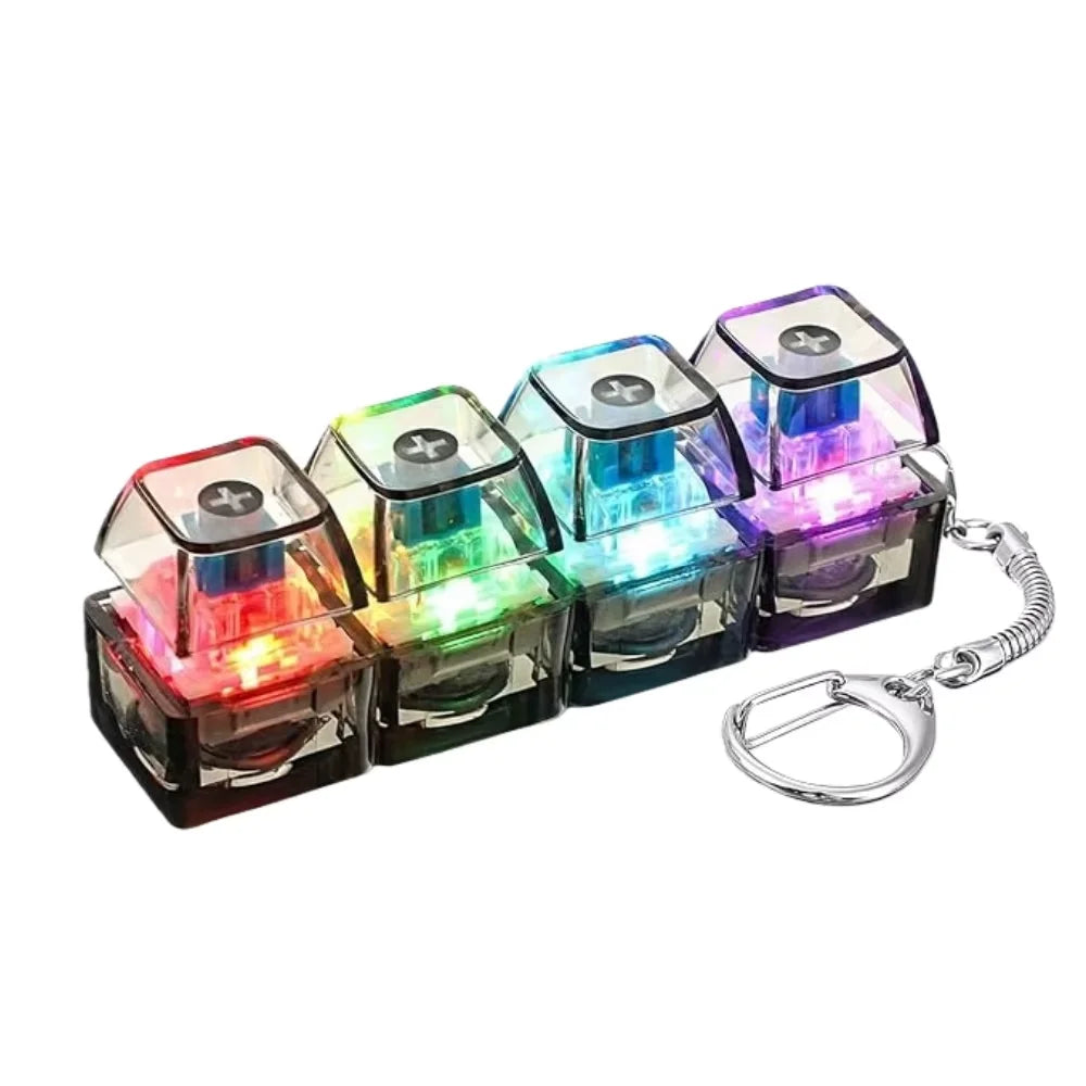 A set of colorful LED fidget keychains shaped like small keyboards.